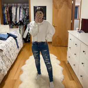 Dark wash American Eagle jeans with covered rips